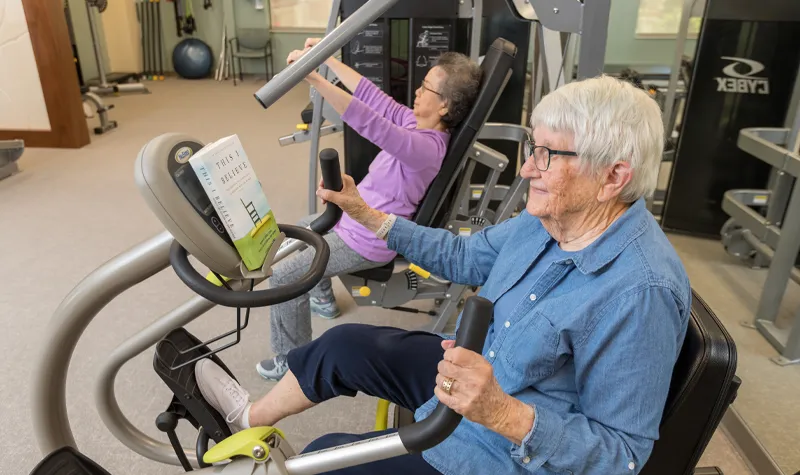 Elderly Women Using Exercise Equipment