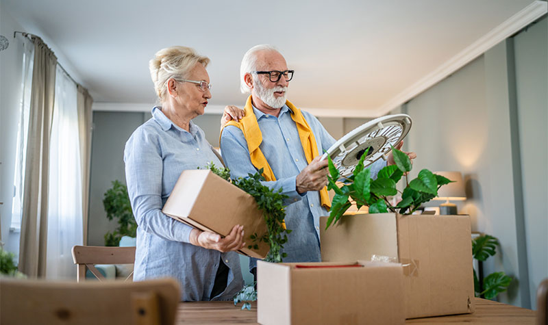 Elderly Couple Packing Boxes