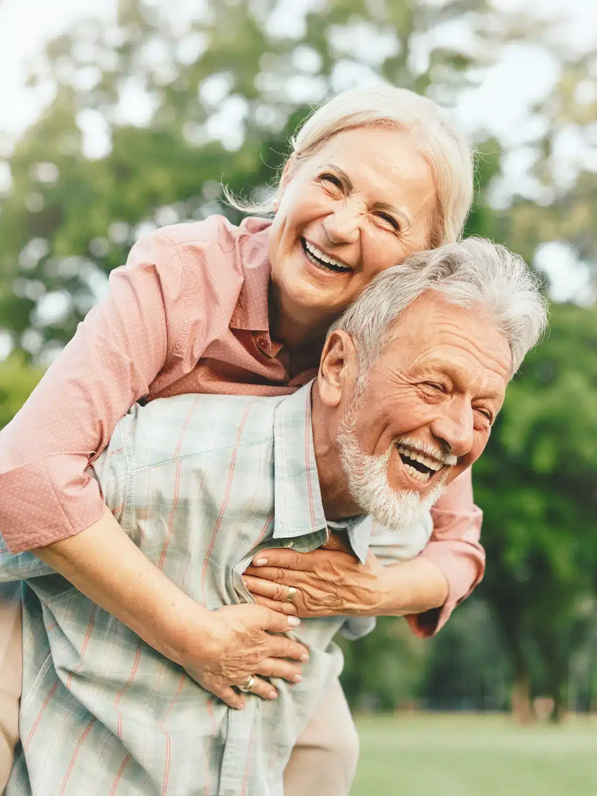 Elderly Couple Smiling Outside Elderly Couple Smiling Outside