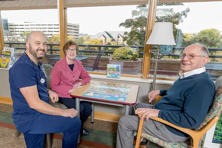 Residents Sitting Outside With Puzzle