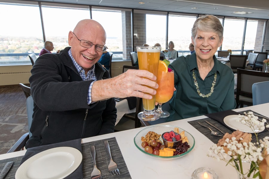 Residents With Drinks In Hands Cheering