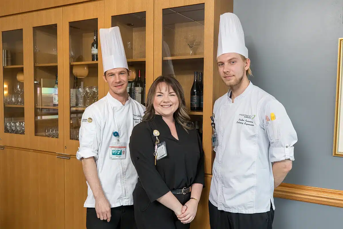 Three Food Service Professionals Smiling