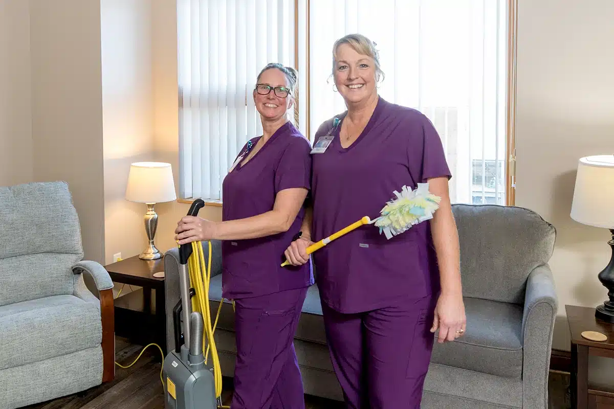 Two Ch Employees In Purple Scrubs